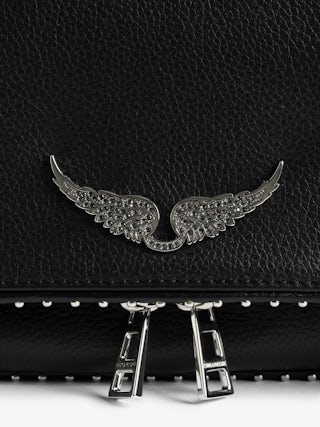 Rock Studs Pochette - Iconic rock clutch in black grained leather with studs.