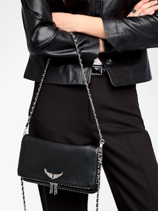 Rock Studs Pochette - Iconic rock clutch in black grained leather with studs.