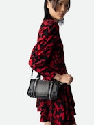 XS Sunny #2 Bag - Women’s small zipped bag in black leather with studs and a shoulder strap.