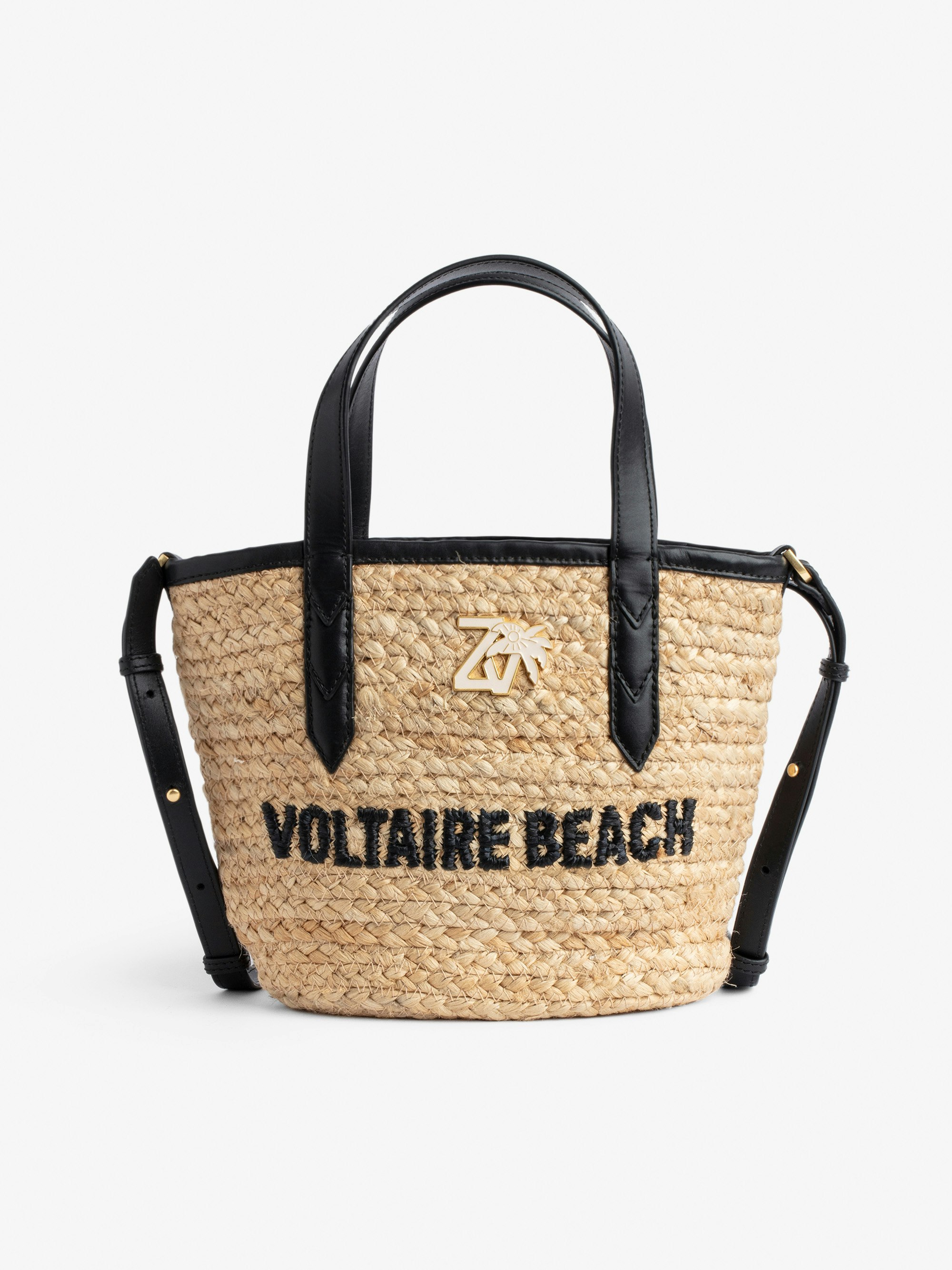 Sac Le Baby Beach Bag - Sac en paille à bandoulière en cuir noir, brodé "Voltaire Beach" et orné d'un charm ZV.