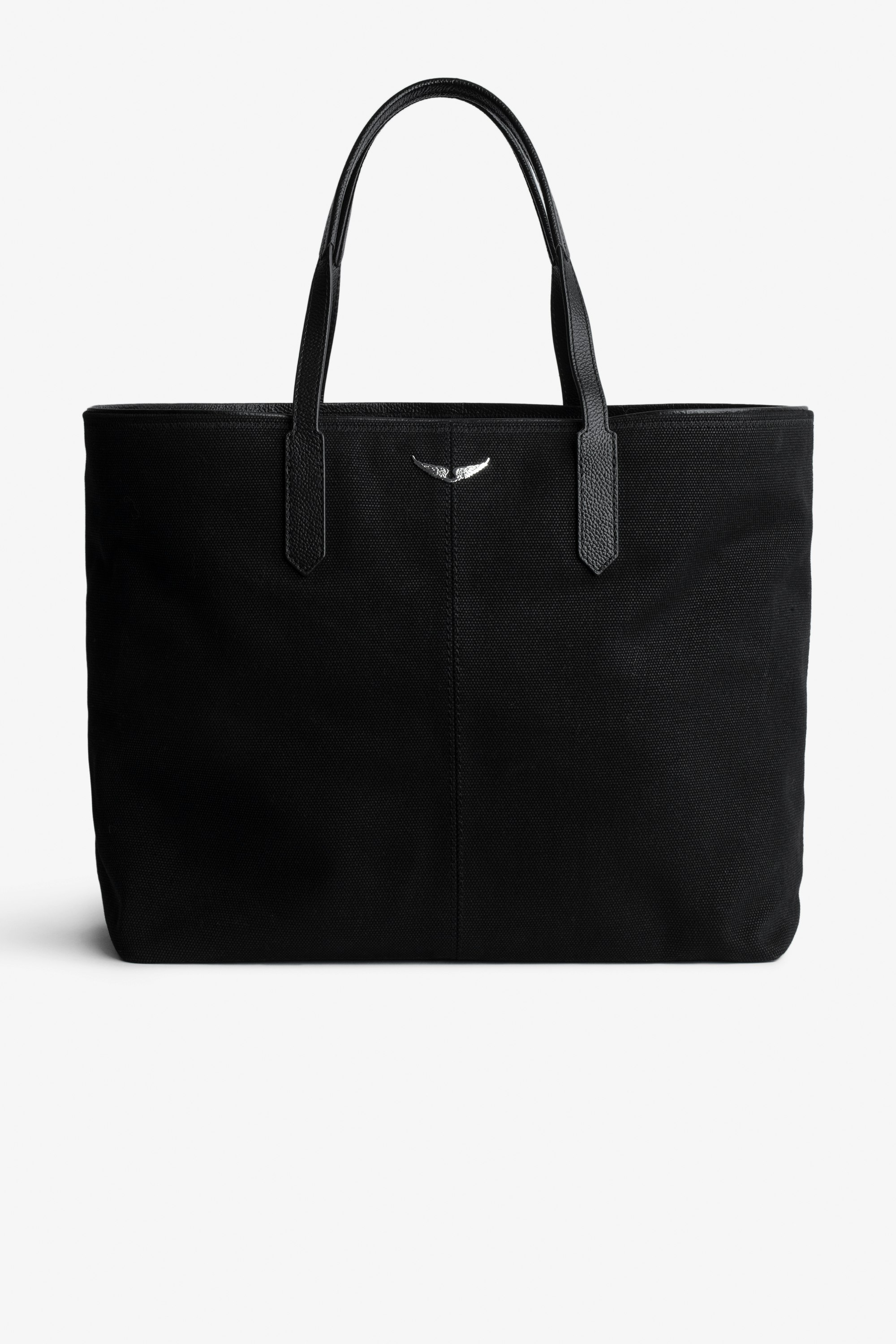 Mick Canvas Bag - Black canvas tote bag with silver wings charm on front.