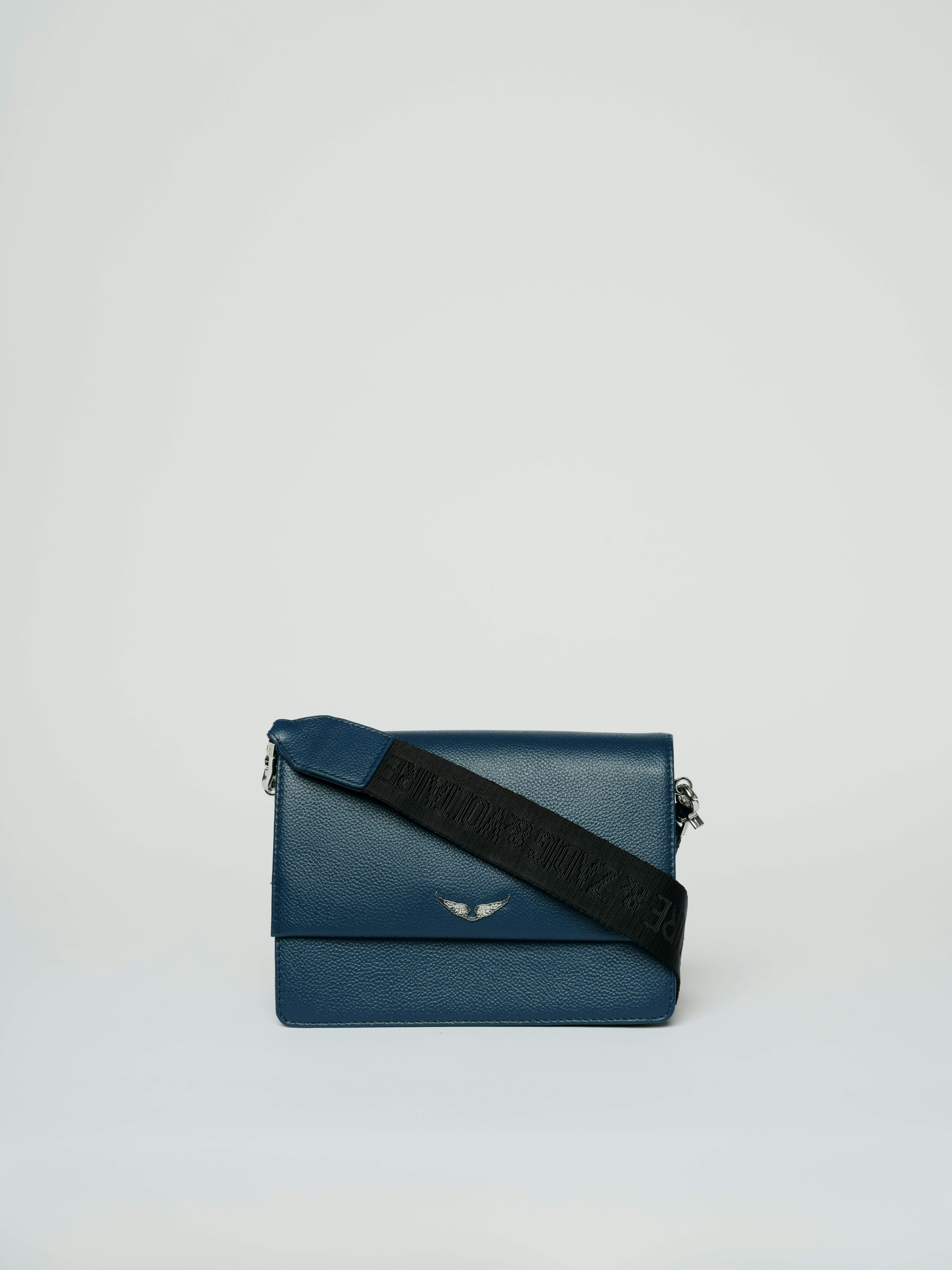 Lolita Wings Bag - Navy blue leather bag with wing embellishment on front.
