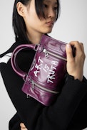 Sunny XS #2 Tag Bag - Women’s burgundy vintage-effect patent leather bag with handle and shoulder strap with wings and “Art is truth” tags.