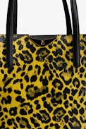 Le Borderline Leopard Bag - Women’s reversible tote bag in yellow leopard-print patent leather with handle and metal wings.