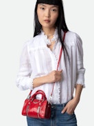 Sunny Nano #2 Bag - Small red vintage-effect patent leather bag with short handles and shoulder strap.
