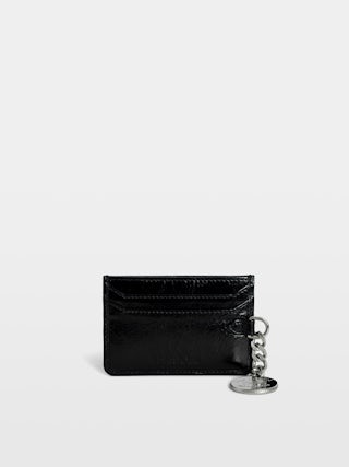 Sunny Pass Vintage Patent Card Holder - Vintage patent leather card holder with medallion charm and wing signatures.