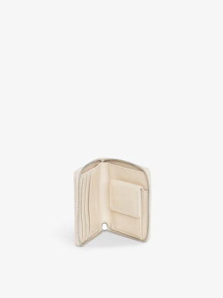 Sunny Mini Wallet - Vintage-effect patent leather purse with medallion and signature wings.