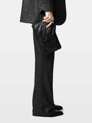 Angel Pochette - Grained leather clutch adorned with an embossed wing signature.