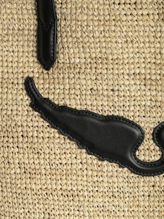 Sac Wings Panier - Panier en raphia avec anses en cuir, orné d'ailes.