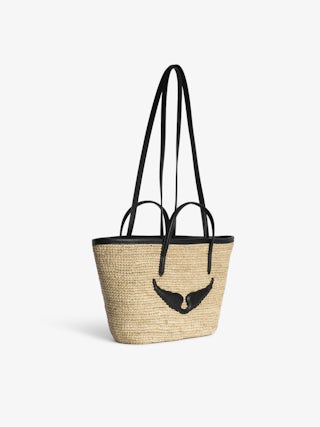 Mini Wings Basket Bag - Small raffia basket with leather handles, adorned with wings.