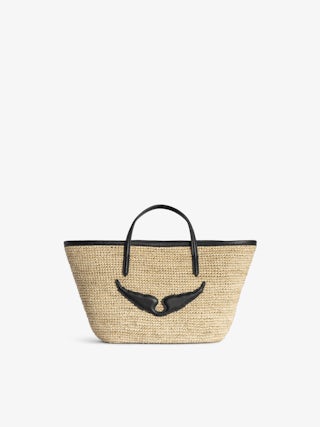 Mini Wings Basket Bag - Small raffia basket with leather handles, adorned with wings.