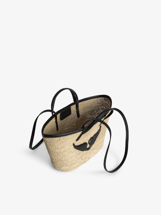 Mini Wings Basket Bag - Small raffia basket with leather handles, adorned with wings.