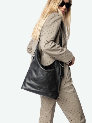 Jane Hobo Bag - Laid-back elegance with a rock ‘n’ roll twist. The Jane hobo bag blends soft, slouchy leather with signature edgy details, featuring the iconic debossed wings on the front for a bold statement. Designed for versatility, its adjustable strap lets you wear it your way—crossbody, shoulder, or effortlessly in hand. An everyday essential, always with an attitude.