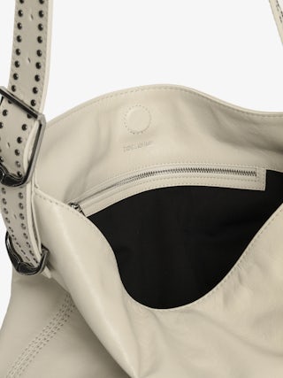 Jane Hobo Bag - Leather Hobo bag with studded handle and debossed wing signature.