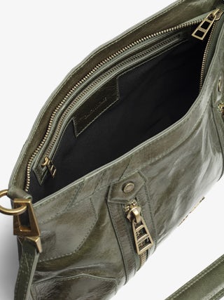 Sunny Moody Vintage Patent Bag - Vintage-inspired patent leather bag with adjustable strap and wing signature.