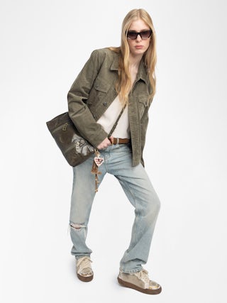 Sunny Moody Vintage Patent Bag - Vintage-inspired patent leather bag with adjustable strap and wing signature.