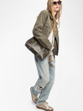 Sunny Moody Vintage Patent Bag - Vintage-inspired patent leather bag with adjustable strap and wing signature.