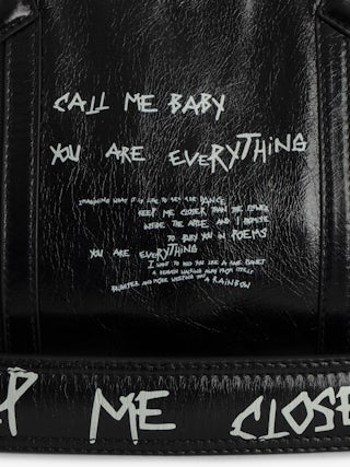 Sunny Moody Bag - Vintage-effect patent leather bag with graffiti, adjustable shoulder strap, and signature metal wings.