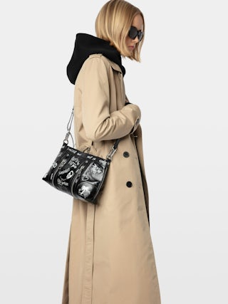 Sac Sunny Moody - Sac en cuir vernis effet vintage tagué, à bandoulière ajustable et signature ailes.