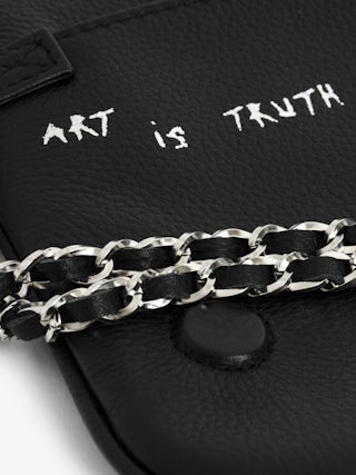 Rock Clutch - Graffiti-printed grained leather clutch with double chain in leather and metal, and wings adorned with rhinestones.