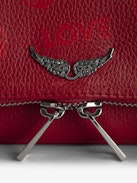 Pochette Rock Nano - Pochette en cuir grainé Cherry avec ailes signatures ornées de strass.