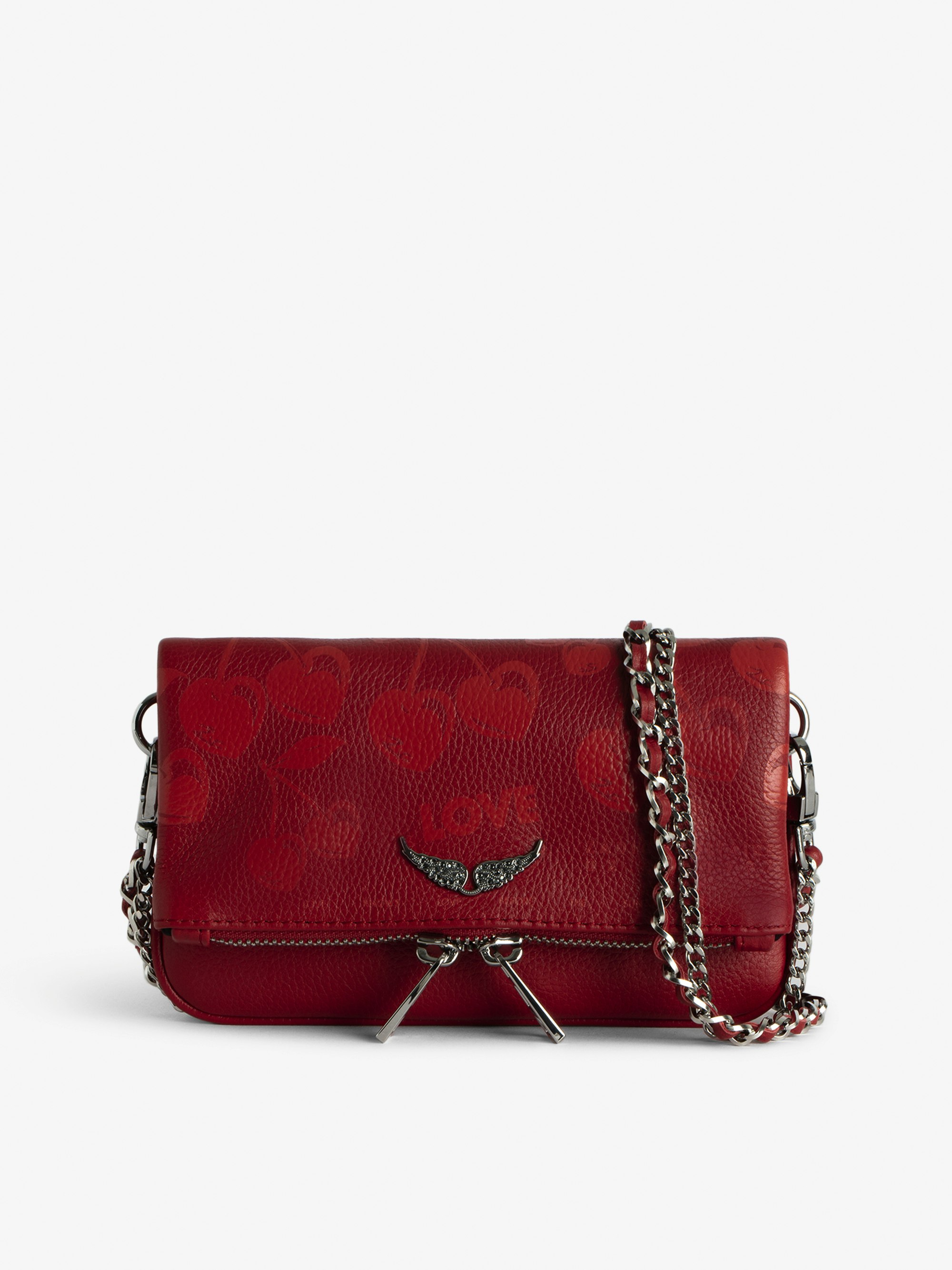 Rock Nano Tasche - Cherry Clutch aus genarbtem Leder mit Signature-Metallflügeln und Strassbesatz.