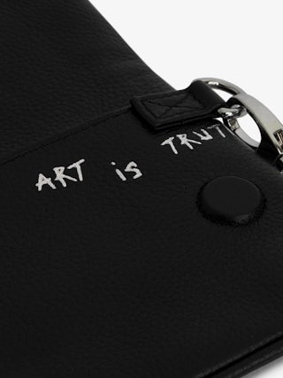 Rock Nano Clutch - Graffiti grained leather pouch with signature wing motif embellished with rhinestones.