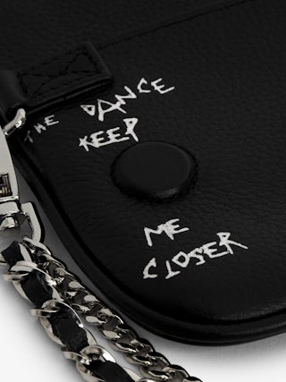 Rock Nano Clutch - Graffiti grained leather pouch with signature wing motif embellished with rhinestones.