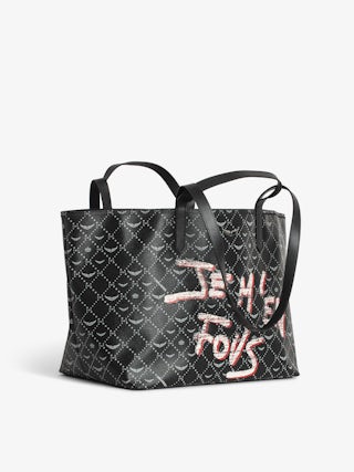 Z Monogram XL Shopper Graffiti Tote Bag - Urban rebellion meets Parisian luxury in this graffiti tote bag designed in coated monogram canvas. The bold, tagged print and signature wings bring rock-inspired edge to an everyday essential. With double handles for versatility and a spacious interior, this graffiti tote bag is perfect for carrying your world in style, whether for city errands, weekend escapes, or statement-making moments.