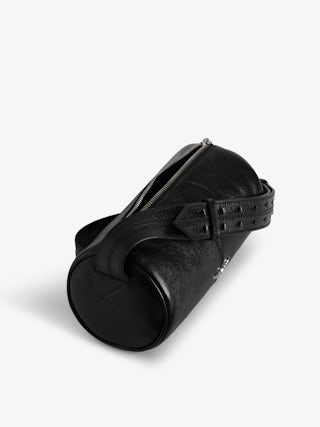 Le Doudou Black Barrel Bag - Timeless rebellion meets a Parisian edge in this black barrel bag crafted from vintage-effect patent leather. Sleek yet distinctive, it redefines everyday luxury with Zadig&Voltaire’s signature wings and modern proportions. Designed with an adjustable strap and versatile zip closure, this black barrel bag transitions seamlessly from day to night, making it the perfect piece for women who embrace both sophistication and attitude.