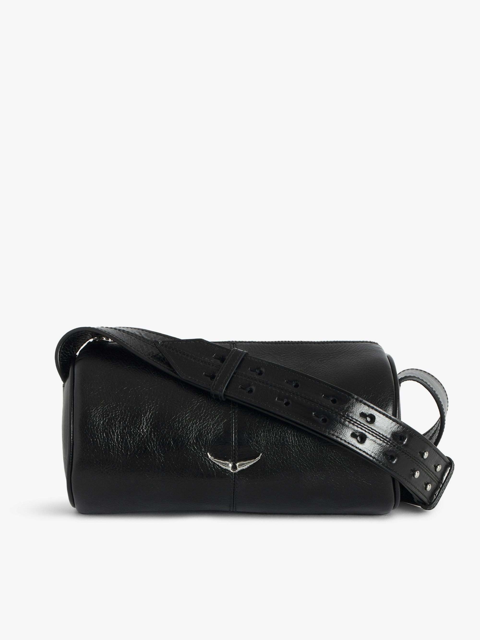 Le Doudou Bag - Vintage-effect patent leather bag with adjustable strap and signature wings.