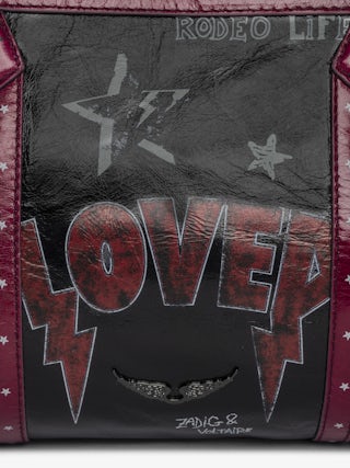 Sunny Moody Punk Bag - Vintage-inspired patent leather bag with adjustable shoulder strap and wing signature.