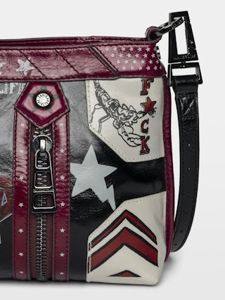 Sunny Moody Punk Bag - Vintage-inspired patent leather bag with adjustable shoulder strap and wing signature.