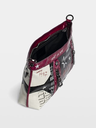 Sunny Moody Punk Bag - Vintage-inspired patent leather bag with adjustable shoulder strap and wing signature.