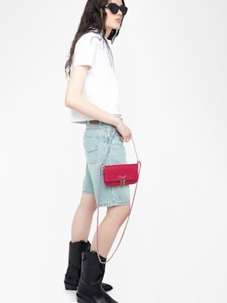 Rock Nano Clutch - Grained leather pochette with double leather and metal chains and rhinestone-adorned wings.