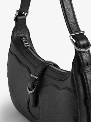 Moonrise Bag - Baguette bag in grained leather with signature wings.