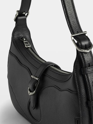 Moonrise Bag - Baguette bag in grained leather with signature wings.