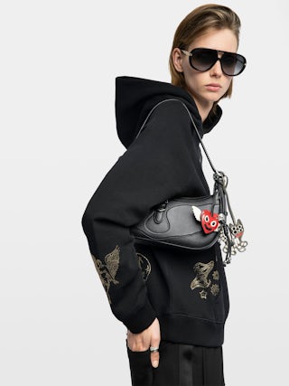 Moonrise Bag - Baguette bag in grained leather with signature wings.