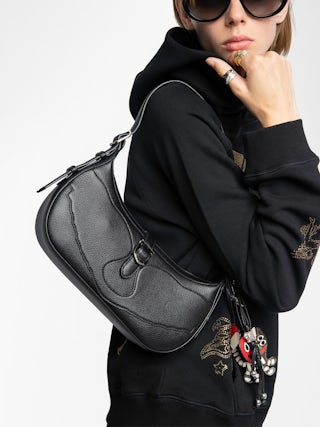 Moonrise Bag - Baguette bag in grained leather with signature wings.