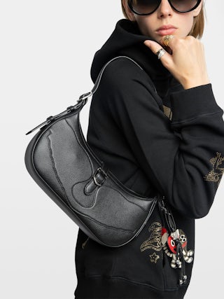 Moonrise Bag - Baguette bag in grained leather with signature wings.