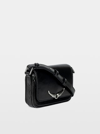 Le Zazi Vintage Patent Bag - Small vintage-inspired patent leather bag with adjustable shoulder strap and signature wings.