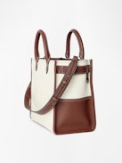 Angel Tote - Canvas and grained leather tote bag with double handles, shoulder strap and wing signature.