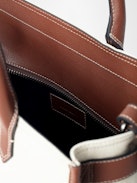 Angel Tote - Canvas and grained leather tote bag with double handles, shoulder strap and wing signature.