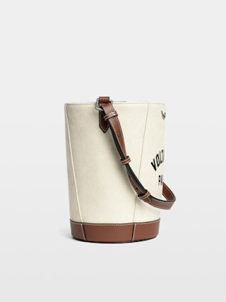 Z Bucket Voltaire Bag - Canvas and grained leather bucket bag with adjustable strap and wing signature.