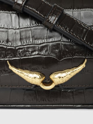 Le Zazi Croco Bag - Small croco-effect leather bag with adjustable shoulder strap and signature wings.