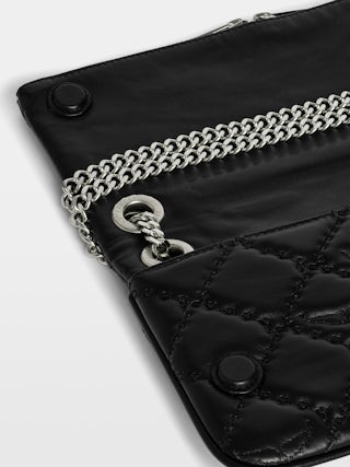 Rock II Quilted Monogram Clutch - Clutch in smooth quilted leather with adjustable metal chain and signature wings.