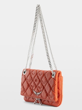 Rock II Quilted Monogram Clutch - Clutch in smooth quilted leather with sliding metal chain and signature wings.