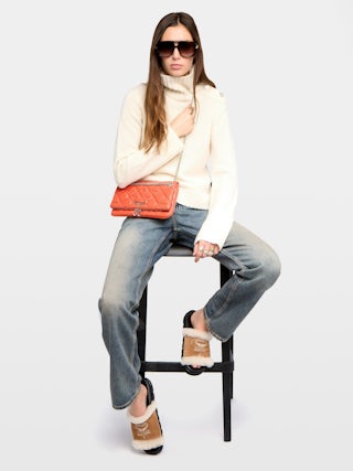 Rock II Quilted Monogram Clutch - Clutch in smooth quilted leather with sliding metal chain and signature wings.