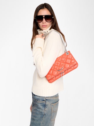 Rock II Quilted Monogram Clutch - Clutch in smooth quilted leather with sliding metal chain and signature wings.