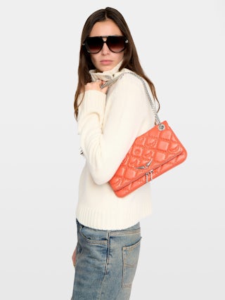 Rock II Quilted Monogram Clutch - Clutch in smooth quilted leather with sliding metal chain and signature wings.